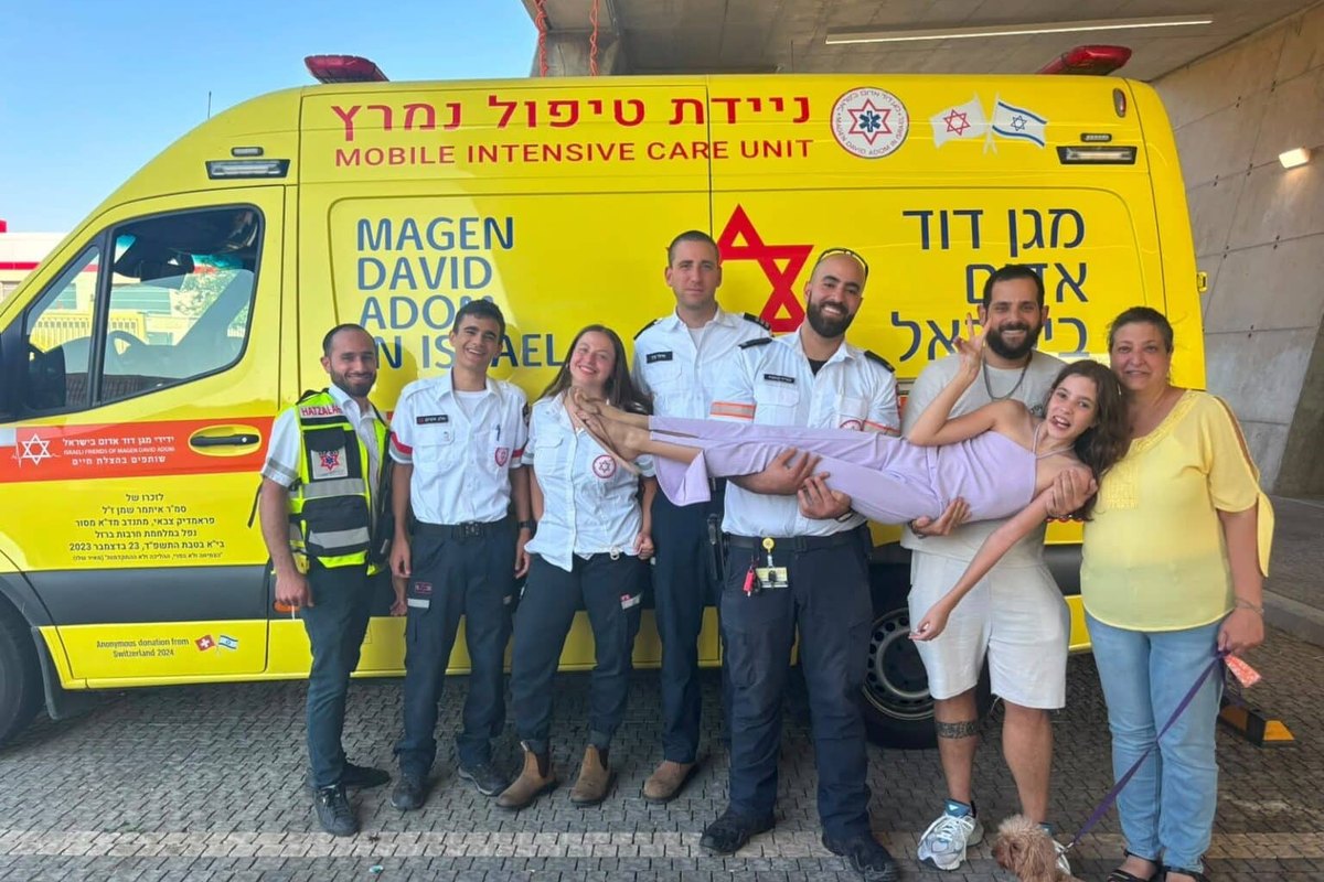 Modiin teen with the MAGEN DAVID ADOM crew in front of a mobile intensive care unit